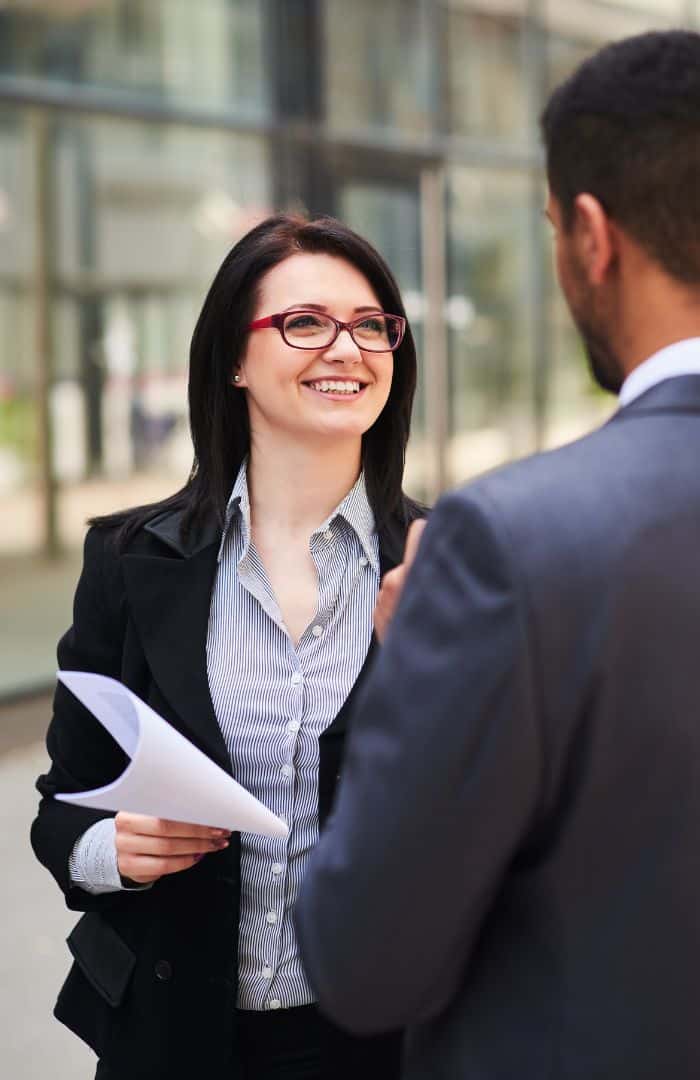 businesspeople going over a report from their small business consulting analysis