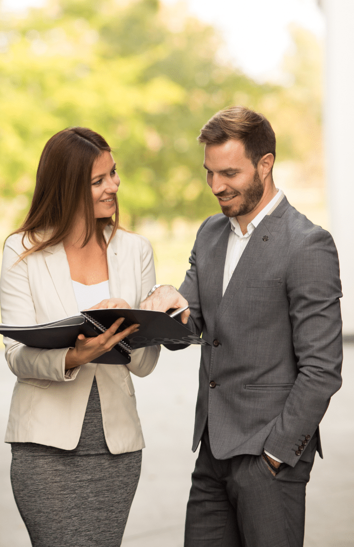 businesspeople reviewing a report from their small business consulting services